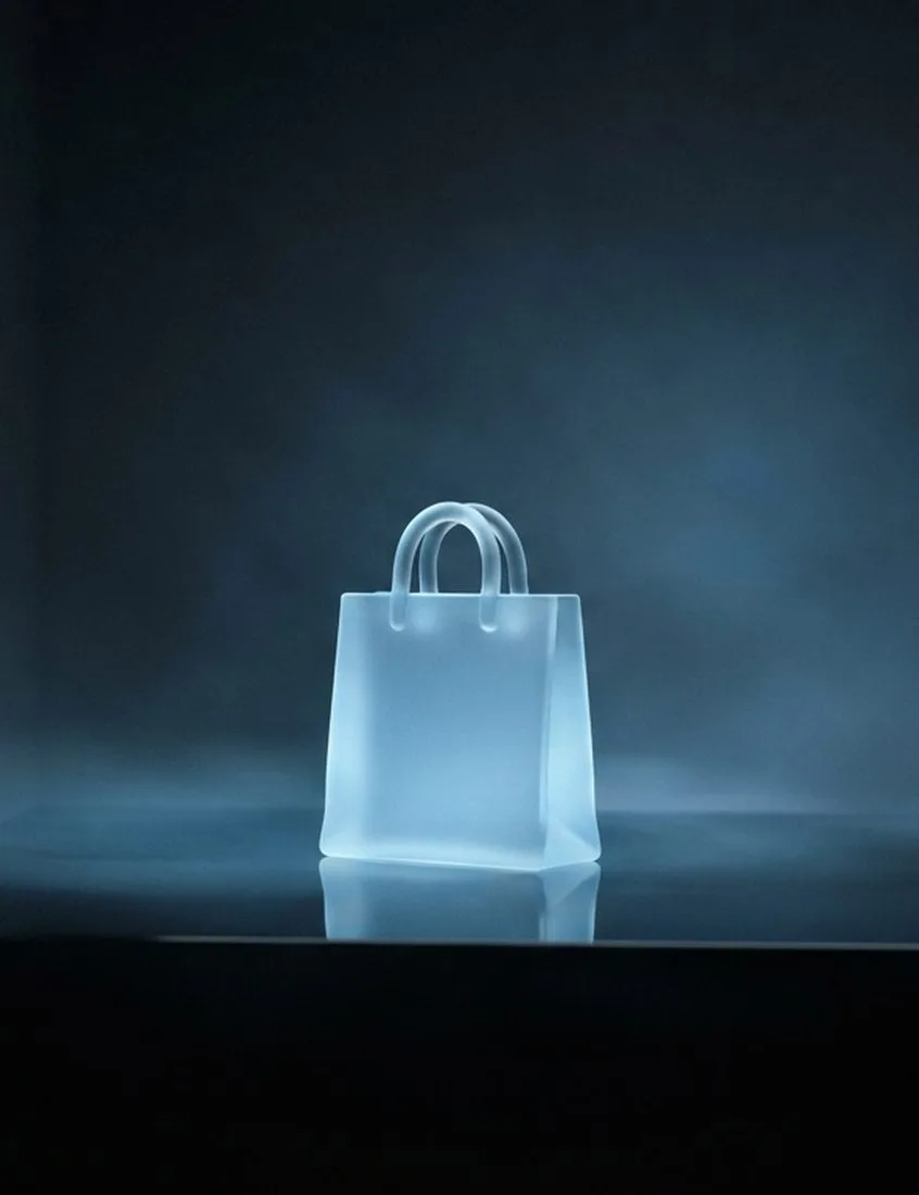 Glowing glass shopping bag representing eCommerce
